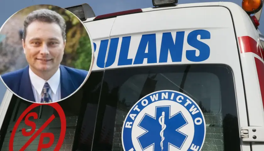 Mężczyzna w garniturze obok karetki. Czyżby to był przełom nadciśnieniowy w jego karierze?